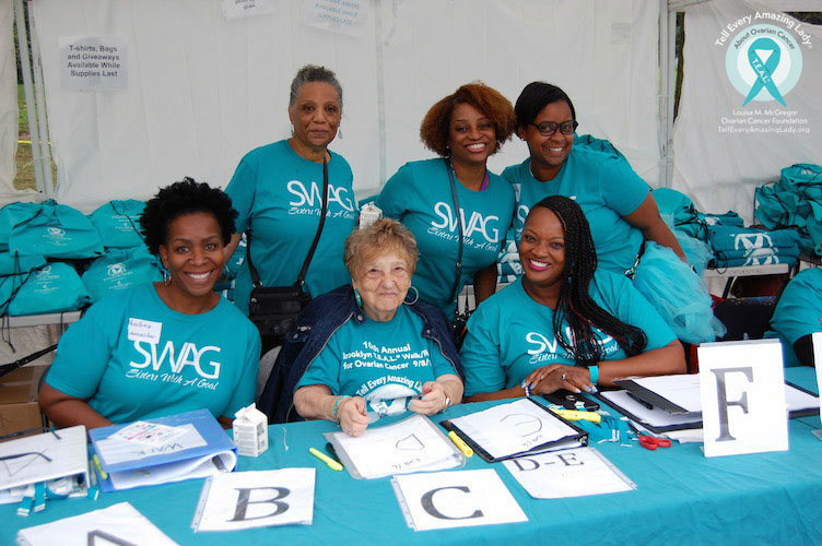 teal walk ovarian cancer run volunteers helping group smile happy